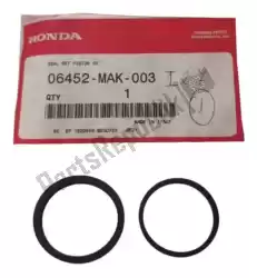 Here you can order the seal set, piston from Honda, with part number 06452MAK003: