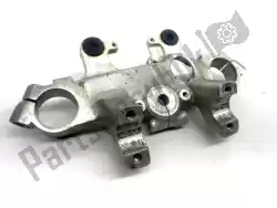 Here you can order the upper triple clamp from Suzuki, with part number 5131107A00: